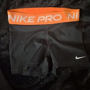 Nike Women's Black and Orange Pro Shorts